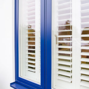 Blue window frames create a striking look