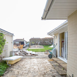 A laundry/utility area will be built bridging this gap between the garage and the old entrance hallway (which will be relocated)