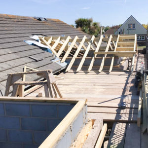 The new entrance porch has a small pitched roof