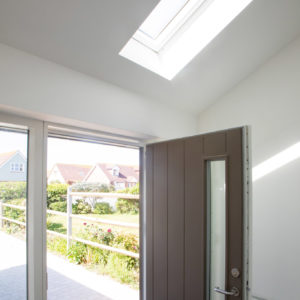 The new entrance hall also has a pitched roof allowing more light in creating an airey feel on entering the house