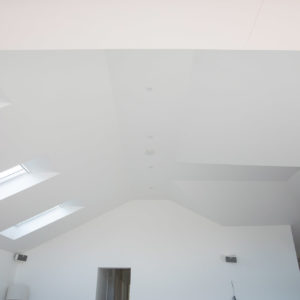 Vaulted ceilings let in a lot of light - the roof windows are all electric