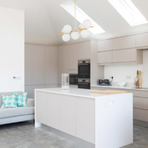 A modern Howdens kitchen with Parador stone tiled effect flooring