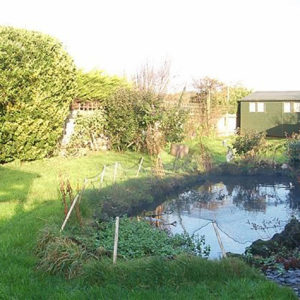 The large pond was not very child friendly and we filled it in - this is where the decking will go.