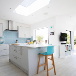 The roof light was positioned over the kitchen island which helps zone and balance the space