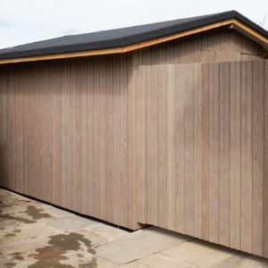 The gate and shed are both clad in larch so they blend in seamlessly