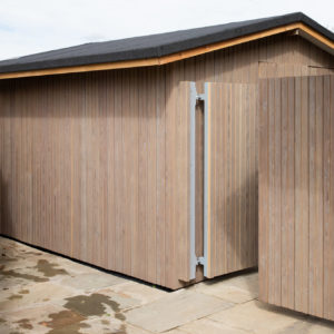 The gate and shed are both clad in larch so they blend in seamlessly