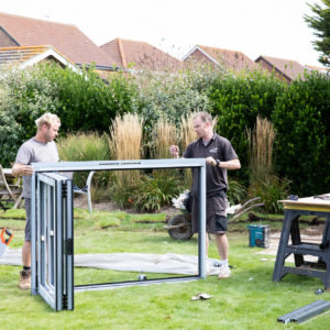 Ian and Graham making finally adjustments to the bifold windows