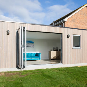 Bi-fold doors fully open to the decking