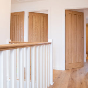 The view across the landing showing all the oak features