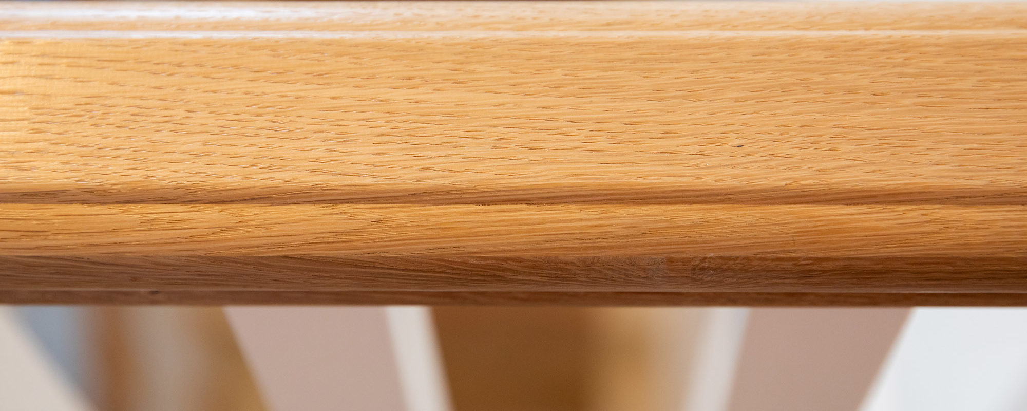 The oak hand rail on the banisters