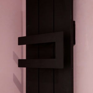 Modern black radiator with towel rail