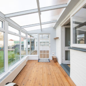 A sliding door will replace the current door (with a cat flap in the glass)