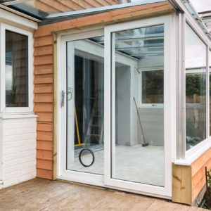 Sliding patio doors are space saving and work well in this area