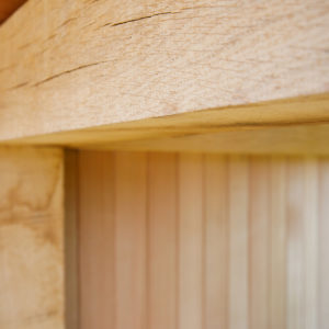 Thick oak beams creates the structure of the outdoor kitchen room