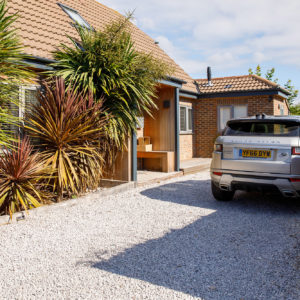 Driveway has been widened, shower moved to back garden, and flower bed removed for more parking space