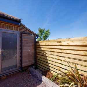 This is the new fence - the horizontal bars compliment the cladding throughout the project