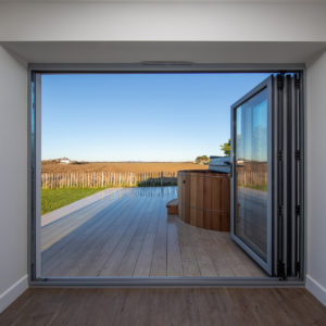 With uninterrupted views over the field, this garden room is one of our favourites