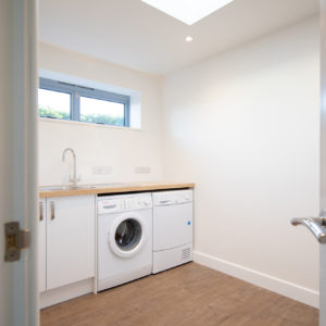 The utility room has high windows for privacy