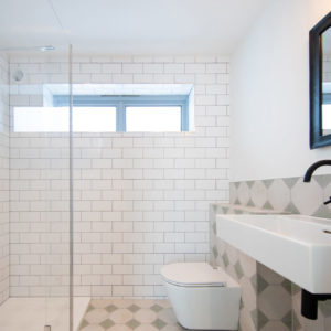 We love the contrast of tiles chosen for this room