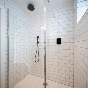 The wall-to-wall metro tiles are so practical in this shower room.
