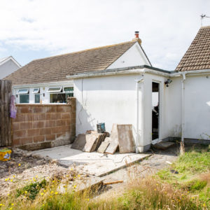 In the garden we are removing an existing raised patio, removing bamboo, building planters, and finally re-turfing the whole garden