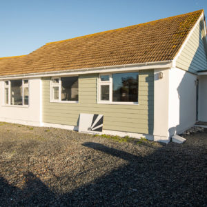 Render and cladding keeps this property watertight and insulated against the sea side storms