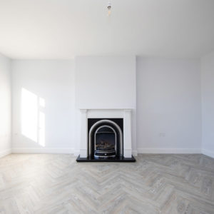 The large spacious south facing lounge has a feature fireplace ready for cosy winter evenings