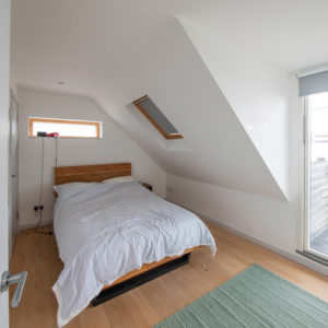 This upstairs bedroom will be dramatically changed with full height ceilings and bigger windows for the sea view