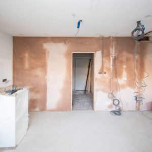 The old kitchen door opening has been moved and freshly plastered over