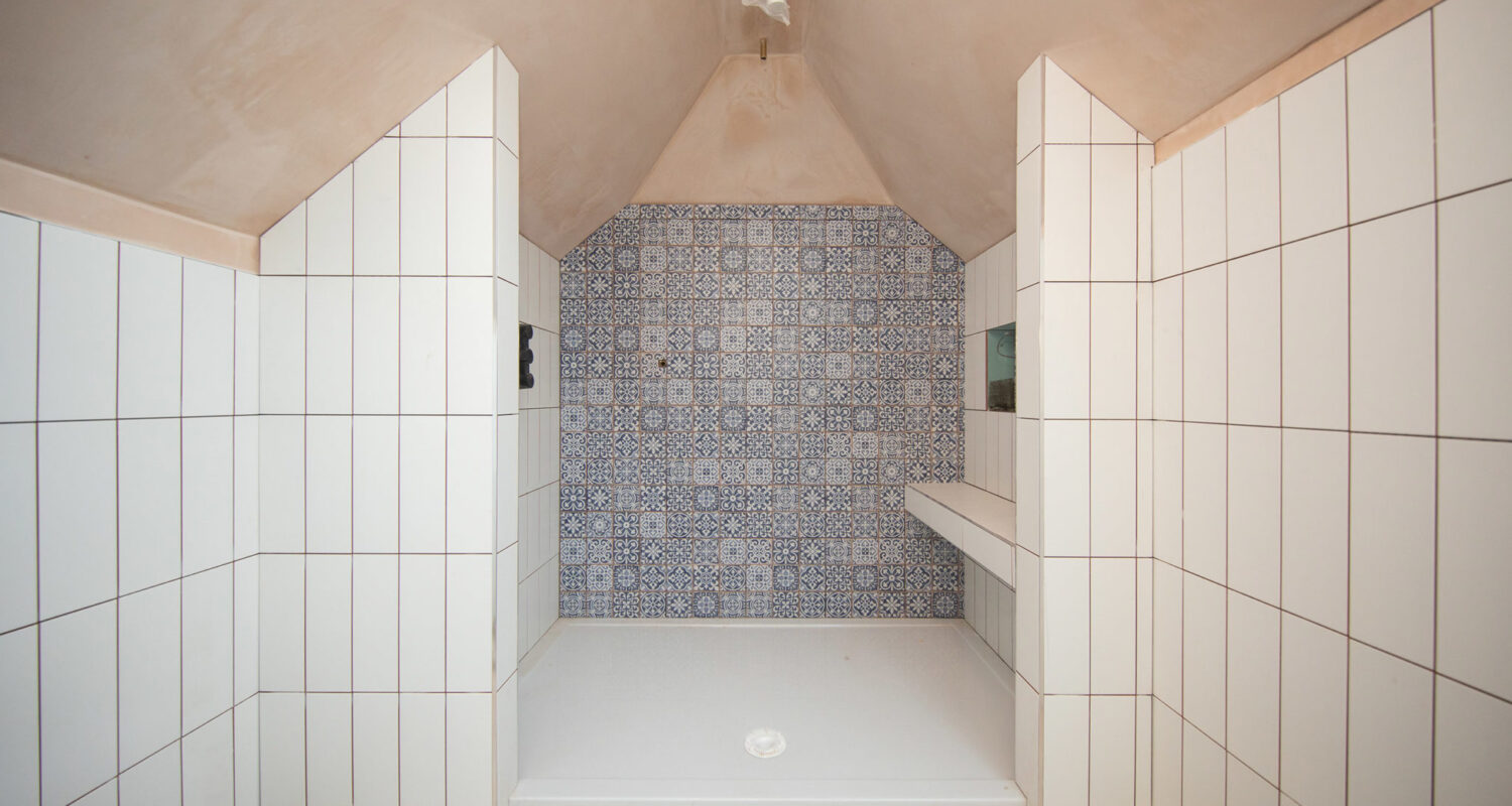 Feature tiles add some luxury to this walk in shower