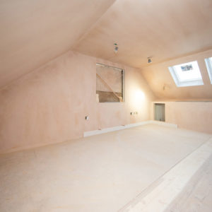The master bedroom is plastered and skirting is being added
