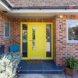 We love the yellow front door. It makes the perfect entrance!