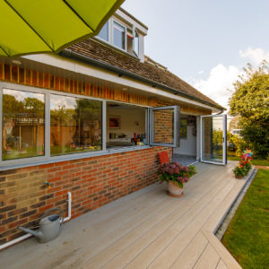 bifold doors open onto the new decking and new garden, linking the spaces well