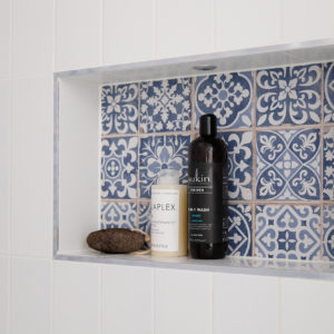 inside the shower cubicle is our signature toiletries cubby hole