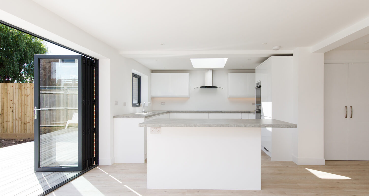 a kitchen island separates the kitchen to the living space