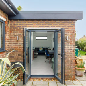 Aluminium doors opening to the patio - these style door also let in lots of light.