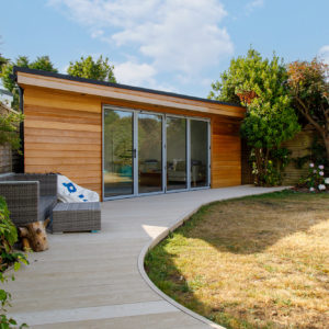 We laid a curved composite decking from the main house to link to the garden room.