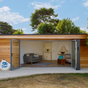 The new garden room is 27 sq metres and slots snugly into the corner of the plot.