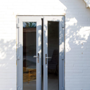 Over in the house we replaced a mid sized window with some patio doors giving the home office some new access.