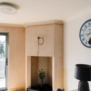 This room lacked a proper focal point this chimney area has been built to house a wood burning stove.