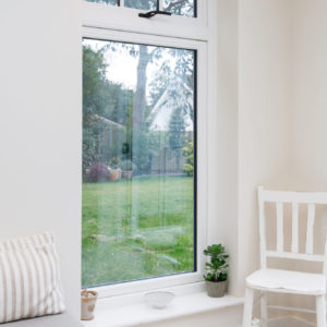 Large windows connect this garden room to the outside