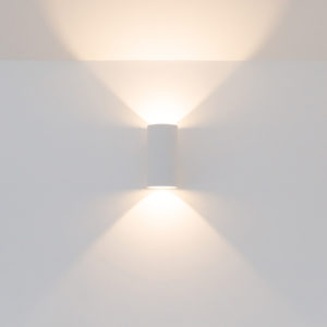 Dimmable wall lights give a versatile soft glow whilst highlighting the vaulted ceiling
