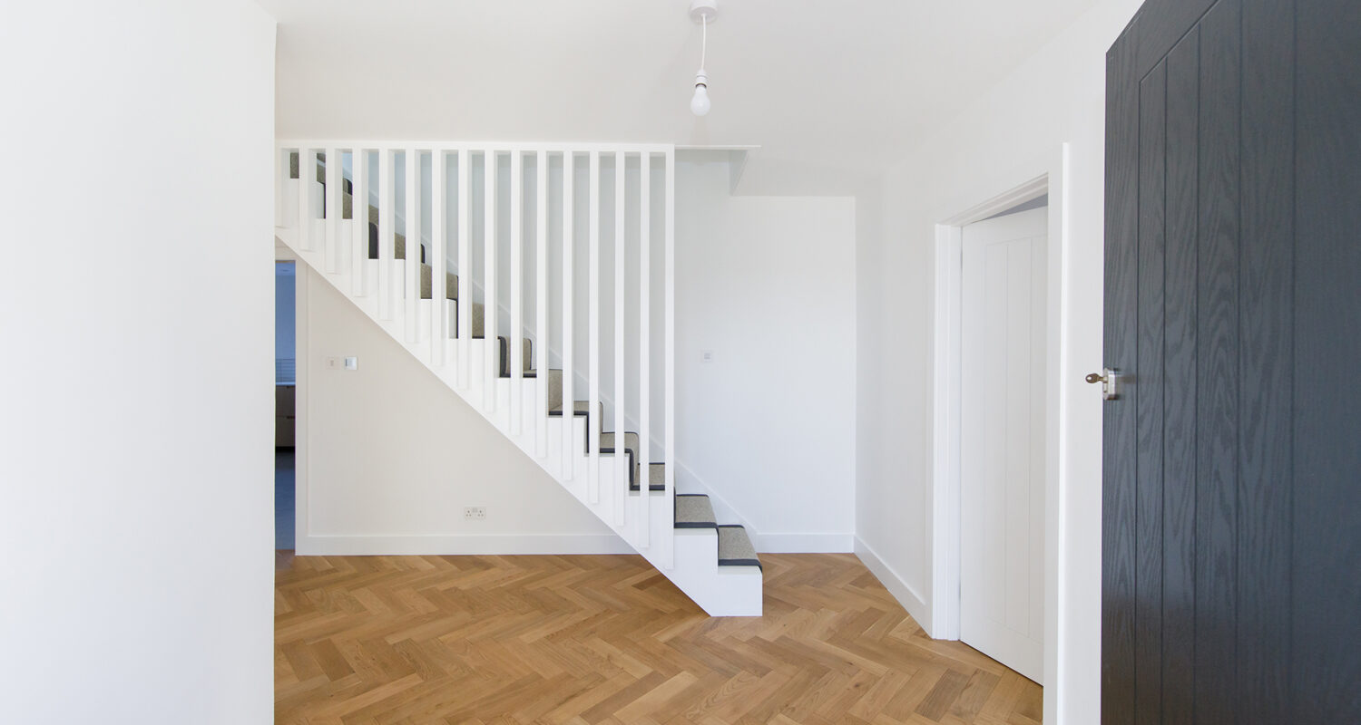 The staircase has been rebuilt and now has trendy vertical spindles for a modern scandi look