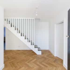 The staircase has been rebuilt and now has trendy vertical spindles for a modern scandi look