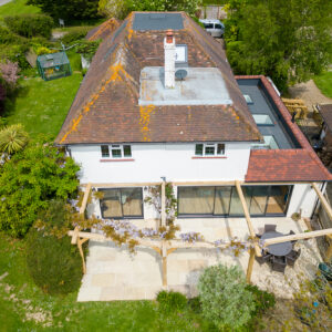 Aerial view showing the full side extension with roof lights