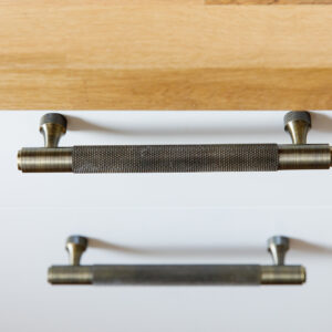 Part of the kitchen makeover are these trendy antique brass handles
