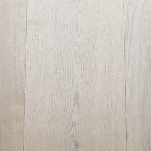 A close up of the new flooring in the front room and hallway to back of house