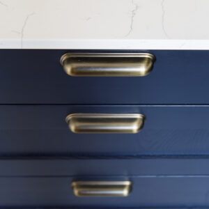 Antique brass handles on the drawers.