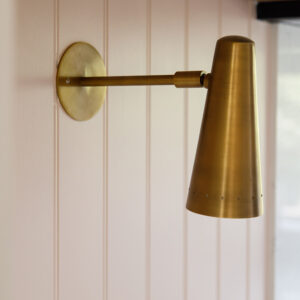 Antique brass lights are a great feature on the back wall of the kitchen