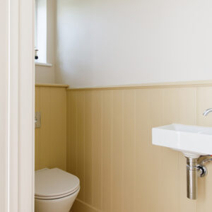 Downstairs the WC has had a complete overhaul and the panelling and wall hung basin give the illusion of more space